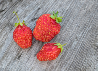 Ripe strawberries on a wooden background