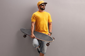 Young man holding a skateboard © Ljupco Smokovski
