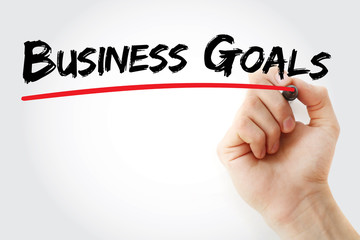 Hand writing Business Goals with marker, concept background