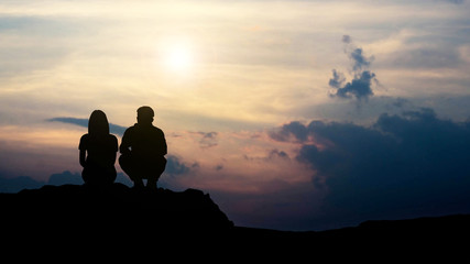 Fototapeta na wymiar silhouette of love guy and girl against sunset