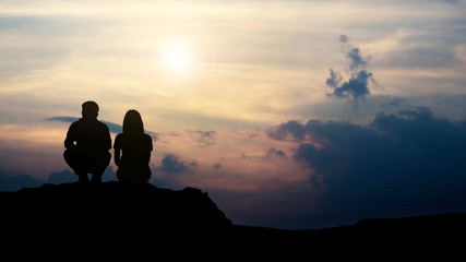 silhouette of love guy and girl against sunset