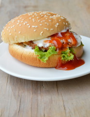 pork hamburger dressing tomato sauce and mayonnaise on dish