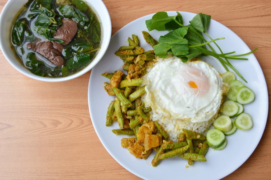 spicy stir fried yard long bean with fat pork curry topping egg and boiled pork blood soup