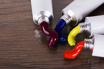 Open tubes with coloured paint coming out
