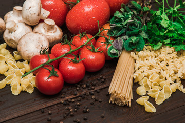 Fresh Italian food on wooden background.