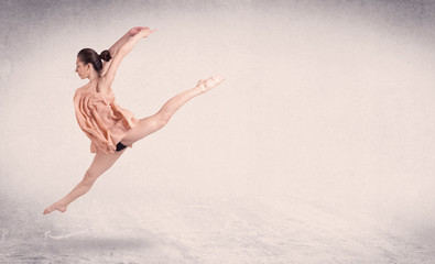 Naklejka na ściany i meble Modern ballet dancer performing art jump with empty background