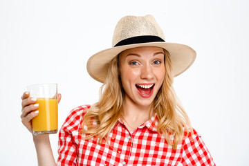 Portrait of beautiful country girl with juice over white background.