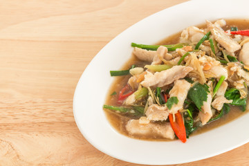 Stir-fried fish with Chinese celery in white dish (Thai food)