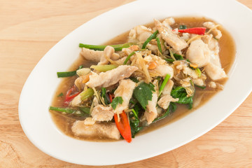 Stir-fried fish with Chinese celery in white dish (Thai food)
