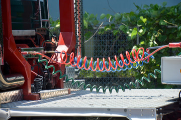 Coiled cable; Trailer on to a truck