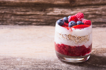 yogurt with oatmeal , blueberries , raspberries and strawberries