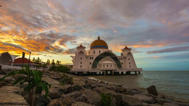 Beautiful Sunrise Over The Straits Mosque (Masjid Selat) at Malacca, Malaysia. One of Malacca's tourist attraction, the mosque was designed to appear floating above water during high tide. 