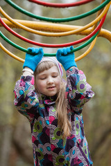 Preschooler girl playing on the playground