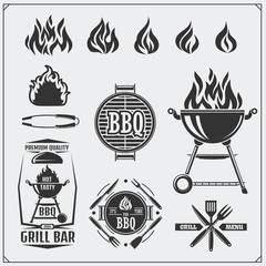 BBQ and grill labels set. Barbecue emblems, badges and design elements. Vector monochrome illustration. - obrazy, fototapety, plakaty