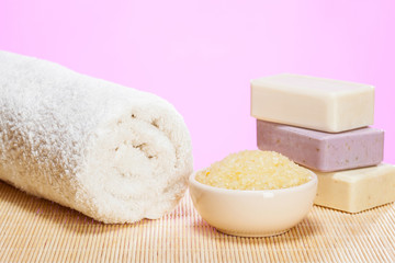 Cotton towel, bowl with sea salt and soap bars