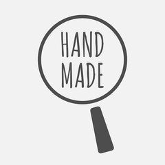 Isolated magnifying glass icon focusing    the text HAND MADE