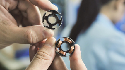 Stator with windings in a factory of little fans.
