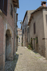 Typical italian alley with medieval houses