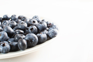 Plate with blueberries.
