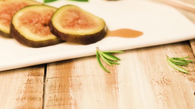 Figs and honey on a wooden table selective focus.
