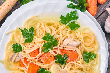 Classic chicken soup with noodles and vegetables