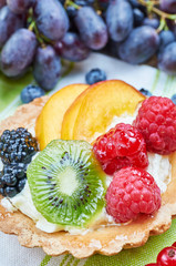 Mix of fruit tarts and fresh fruits