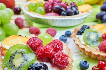 Mix of fruit tarts and fresh fruits