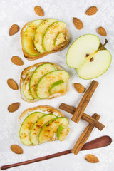 Three sweet toasts with cheese, apples, cinnamon and honey