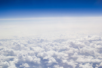 Fototapeta na wymiar Clouds blue sky horizon from above