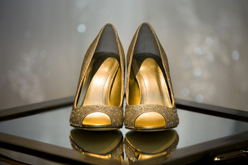 Close up of bridal wedding shoes during pre ceremony preparations