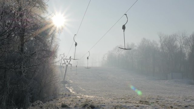 Early morning fog on Kraljevica hill ski slopes 4K 2160p UHD footage - Ski slopes near Eastern Serbian town of Zajecar under snow 4K 3840X2160 UHD video 