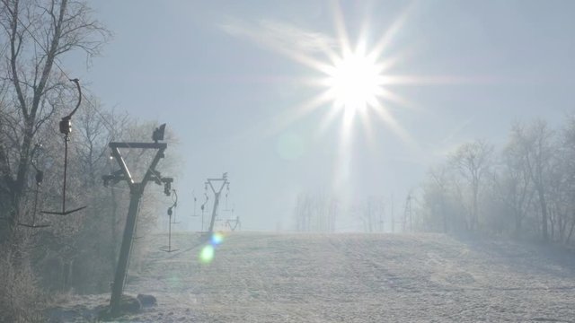 Early morning sun over Kraljevica hill ski slopes 4K 2160p UHD footage - Ski slopes near Eastern Serbian town of Zajecar under snow 4K 3840X2160 UHD video 