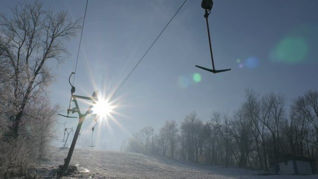 Early morning sun over Kraljevica hill ski slopes 4K 2160p UHD tilting footage - Ski slopes near Eastern Serbian town of Zajecar under snow 4K 3840X2160 UHD video 