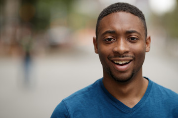 Young black man in city shocked face portrait