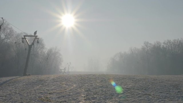 Eastern Serbian Kraljevica hill ski slopes and early morning sun 4K 2160p UHD footage - Ski slopes near Eastern Serbian town of Zajecar under snow 4K 3840X2160 UHD video 