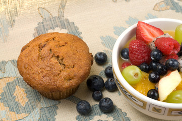 Muffin with Fruit Salad on Antique Tablecloth