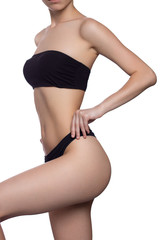Fototapeta premium perfect body of fitness woman in black lingerie isolated on white. hands on waist