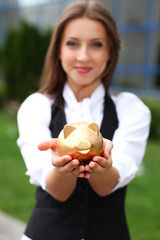 Businesswoman with moneybox