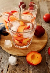 slivovitz (plum brandy) with ice and fresh plums 