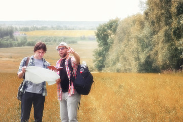 couple people with map in autumn field