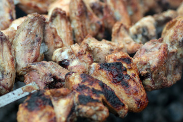 Chicken on the grill to cook
