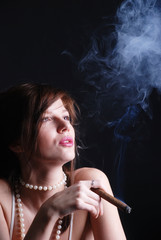 Smoking woman and smoke from mouth