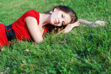 young woman and  green grass