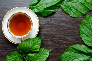 natural herbal antipyretic -organic raspberry leaves tea

in a white porcelain сup with fresh...