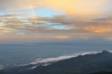 natural rainbow over mountain peak