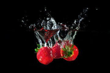 Image of Strawberries splashing into water printed on Printed Glass Splashbacks