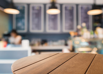 wooden coffee table with coffee shop background