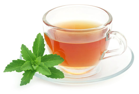 Herbal tea in a cup with stevia leaves