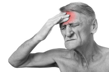 Closeup headshot senior man suffering from headache hands on head   isolated on white background.