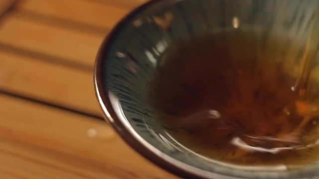 Chinese Black Tea from Old Trees is Poured into a Bowl